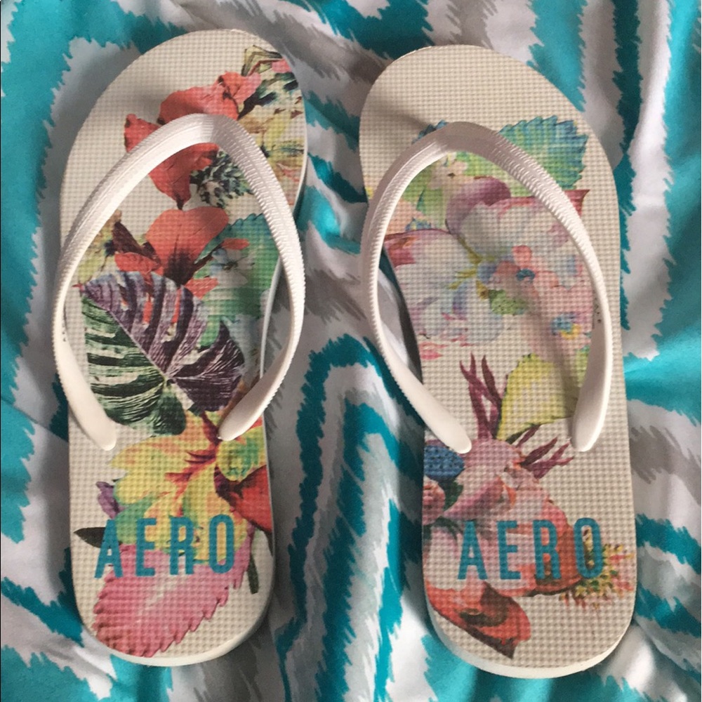 White floral flip flops